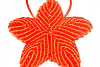 Zdjęcie przedstawia pomarańczową makatę gwiazdkę